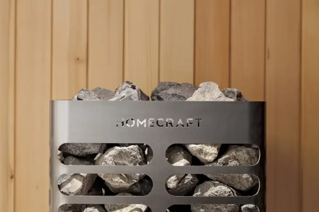 Homecraft Revive electric sauna heater, close view of stones and Homecraft badge