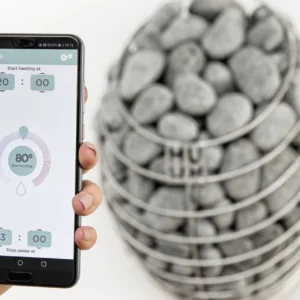 HUUM mobile sauna control app, mobile sauna control app beside a heater
