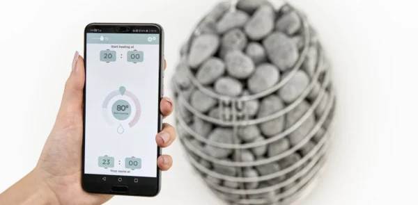 HUUM mobile sauna control app, mobile sauna control app beside a heater