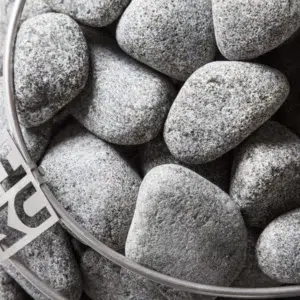HUUM sauna stones, top view of stones inside a heater cage