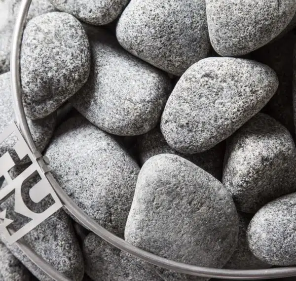HUUM sauna stones, top view of stones inside a heater cage