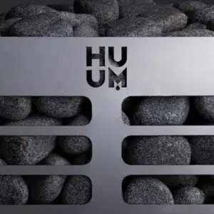 HUUM steel electric sauna heater, close view of stones behind the slotted metal basket