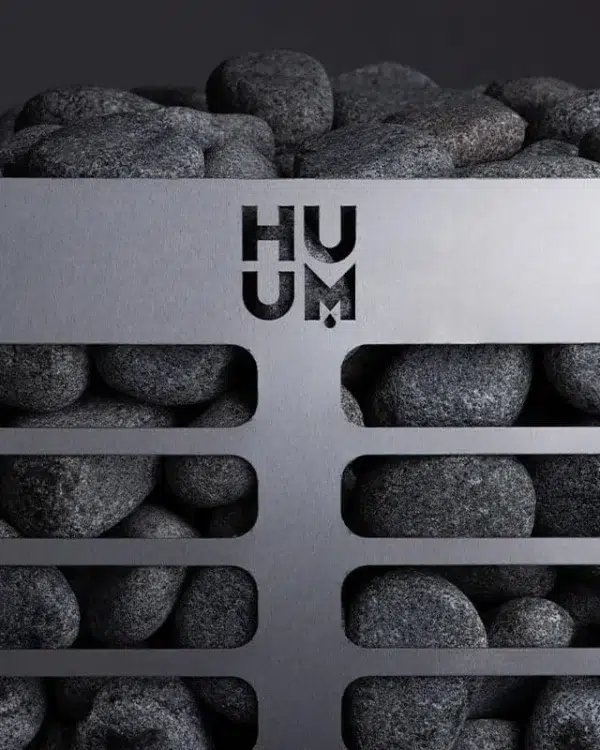 HUUM steel electric sauna heater, close view of stones behind the slotted metal basket