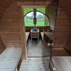Outdoor barrel sauna, changing area and glass sauna door