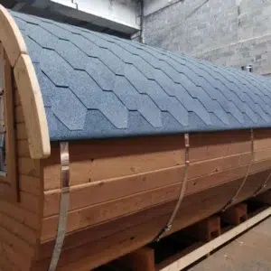 Outdoor barrel sauna, close-up of side cladding and shingle roof