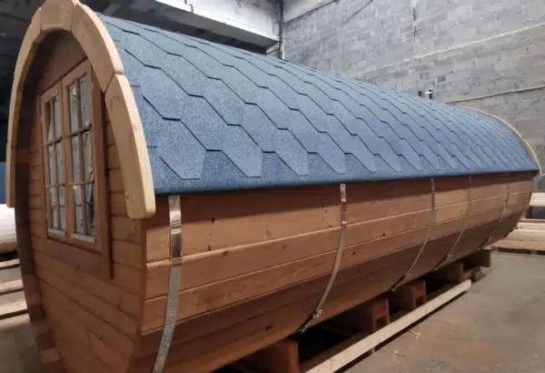 Outdoor barrel sauna, close-up of side cladding and shingle roof
