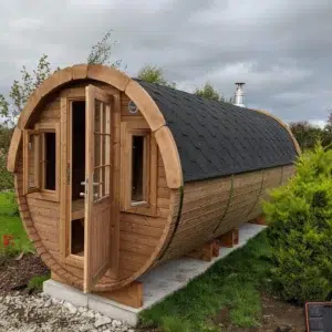 Outdoor barrel sauna, exterior with glazed entrance door and windows