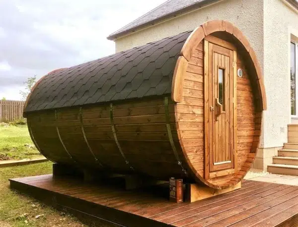 Outdoor barrel sauna, exterior on a wooden deck