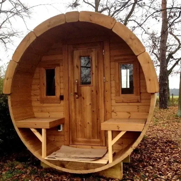 Outdoor barrel sauna, front entrance with porch benches