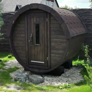 Outdoor barrel sauna, front exterior in a garden