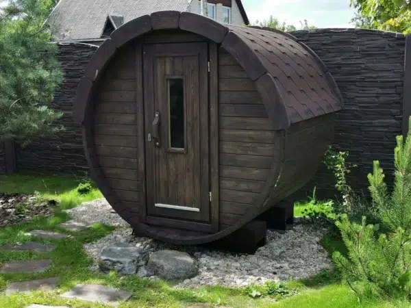 Outdoor barrel sauna, front exterior in a garden