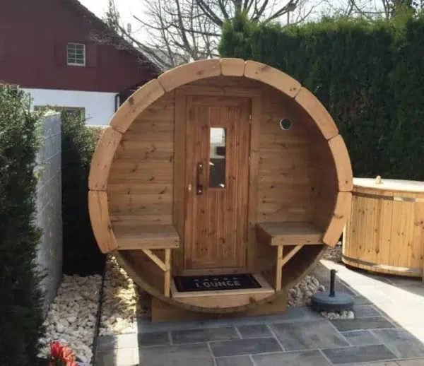 Outdoor barrel sauna, front porch with benches and central entrance
