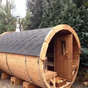 Outdoor barrel sauna, front porch and side exterior among trees