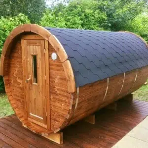 Outdoor barrel sauna, front and side exterior on decking