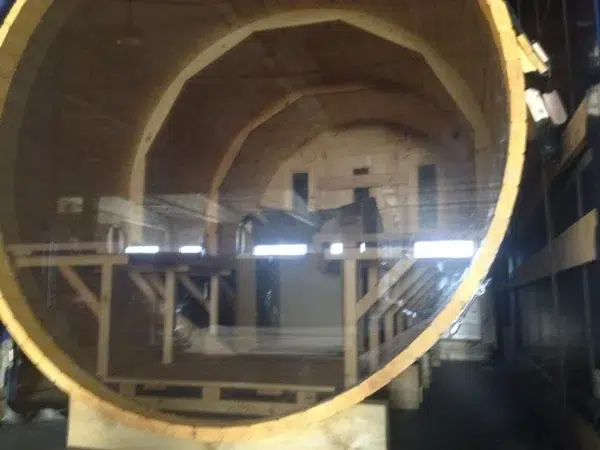Outdoor barrel sauna, full circular window viewed from outside