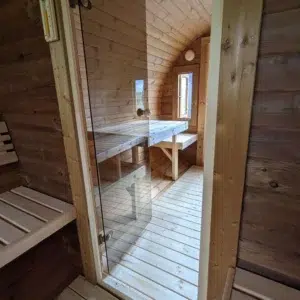 Outdoor barrel sauna, glass door and changing-room seating