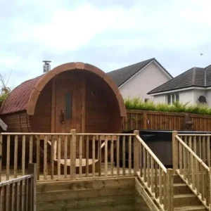 Outdoor barrel sauna, installation on a raised wooden deck