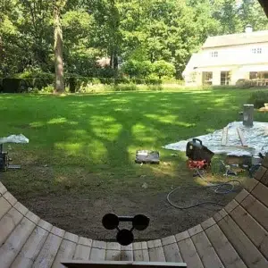 Outdoor barrel sauna, interior view through a circular panoramic window