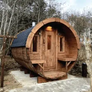 Outdoor barrel sauna with a porch, front exterior with covered entrance seating