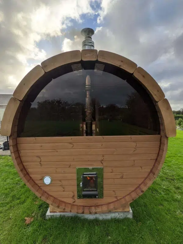 Outdoor barrel sauna, rear exterior with semicircular panoramic window