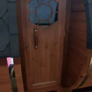 Outdoor barrel sauna, side entrance door with small window