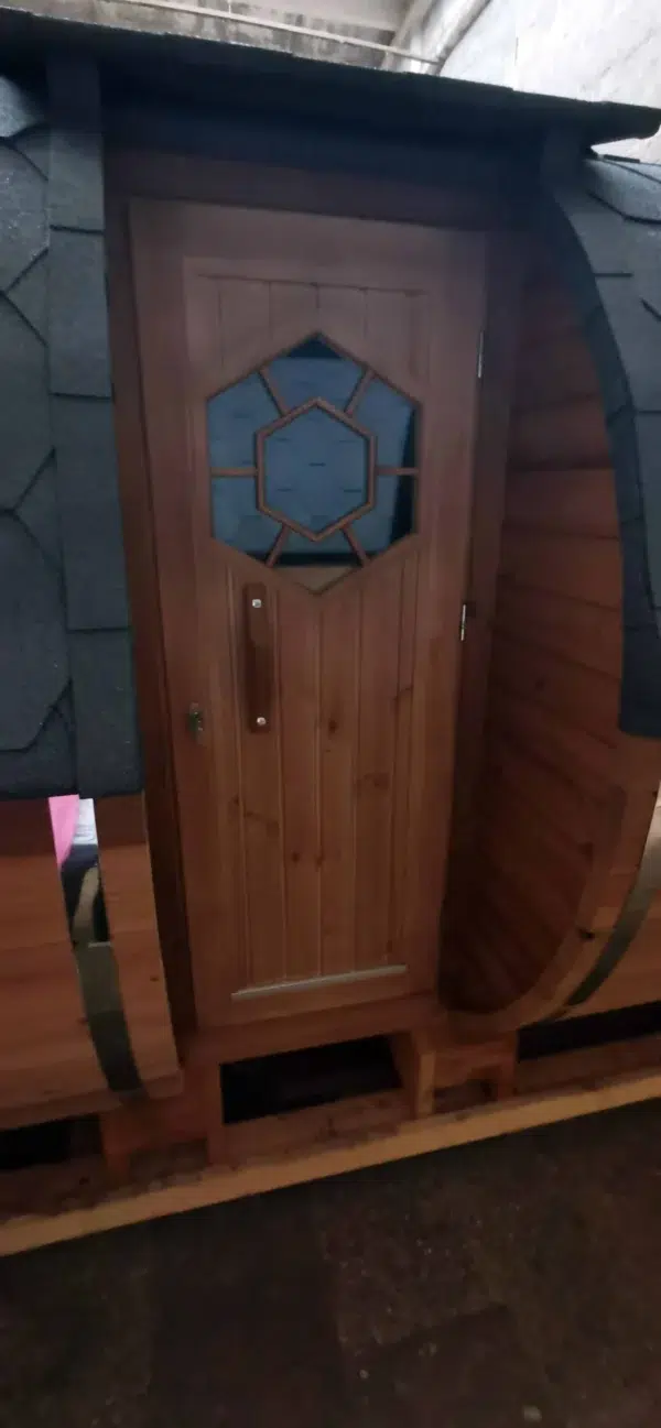 Outdoor barrel sauna, side entrance door with small window
