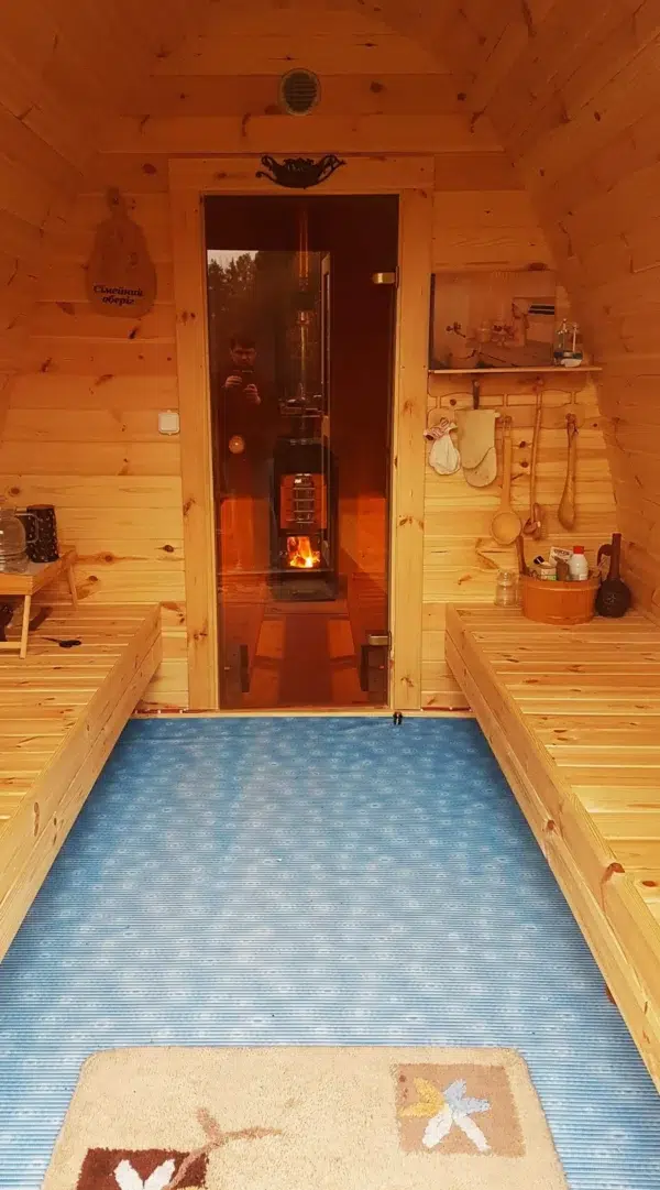 Outdoor pod sauna, changing area with opposing benches