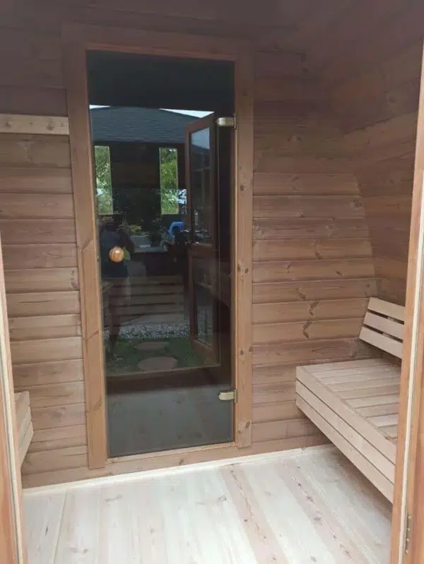 Outdoor pod sauna, changing-room bench and glass sauna door