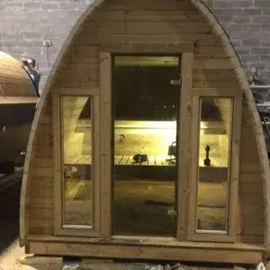 Outdoor pod sauna, front entrance with interior lighting