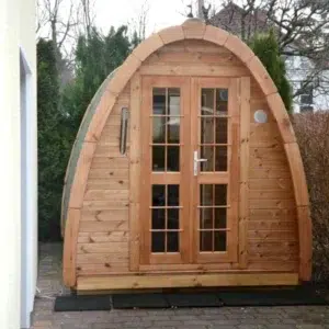 Outdoor pod sauna, front exterior with glazed double doors