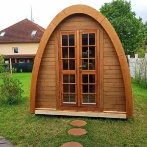 Outdoor pod sauna, front exterior with glazed double doors