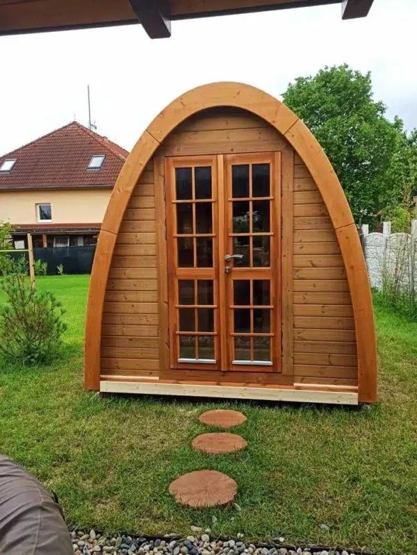 Outdoor pod sauna, front exterior with glazed double doors