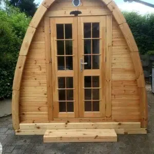 Outdoor pod sauna, front exterior with glazed double doors
