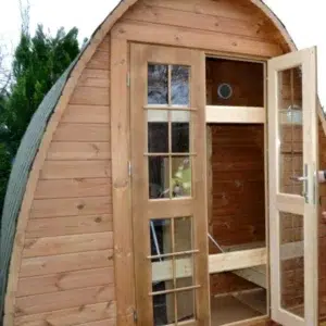 Outdoor pod sauna, open front doors revealing the changing area