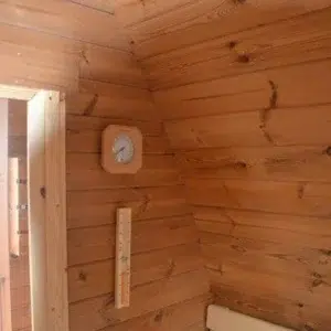 Outdoor pod sauna, wall-mounted thermometer and sand timer