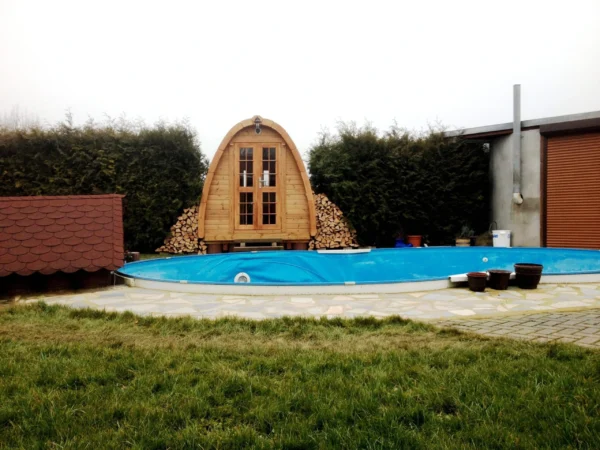 Outdoor pod sauna, wide view of poolside sauna installation