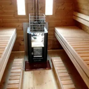 Outdoor pod sauna, wood-burning stove between opposing benches