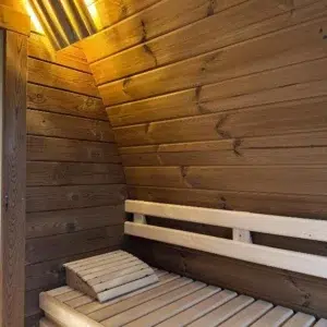 Outdoor pod sauna, wooden bench with backrest and headrest