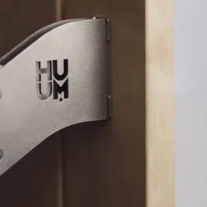 Safety Railing for HUUM Drop Sauna Heater, close-up of the wall mounting bracket