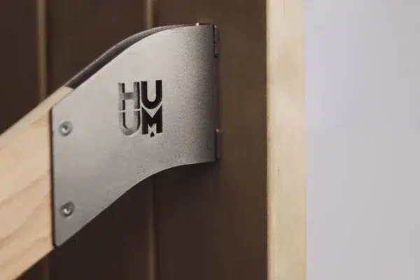 Safety Railing for HUUM Drop Sauna Heater, close-up of the wall mounting bracket
