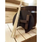 TESLI BAMBOO Sauna Whisk, resting beside a sauna bucket