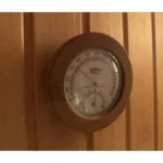 TESLI SMALL Sauna Thermometer, mounted on a wooden sauna wall