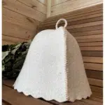 TESLI WHITE Natural Felt Sauna Hat, hat placed on a sauna bench