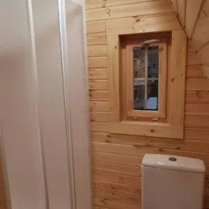 Wooden camping pod, bathroom with shower and toilet