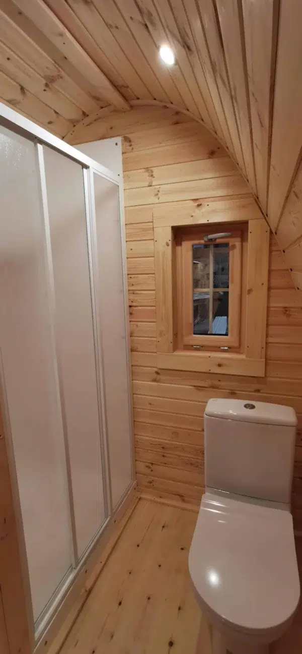 Wooden camping pod, bathroom with shower and toilet