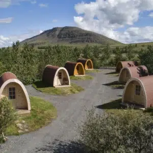 Wooden camping pod, camping pods arranged along gravel paths