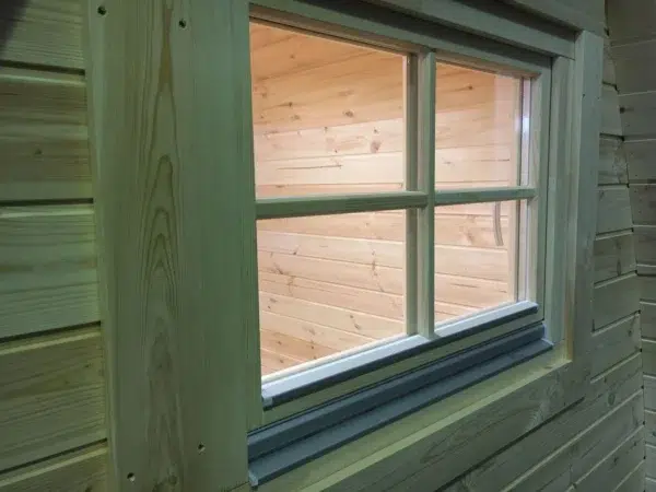 Wooden camping pod, close-up of an exterior window