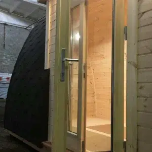 Wooden camping pod, close-up of glazed double entrance doors