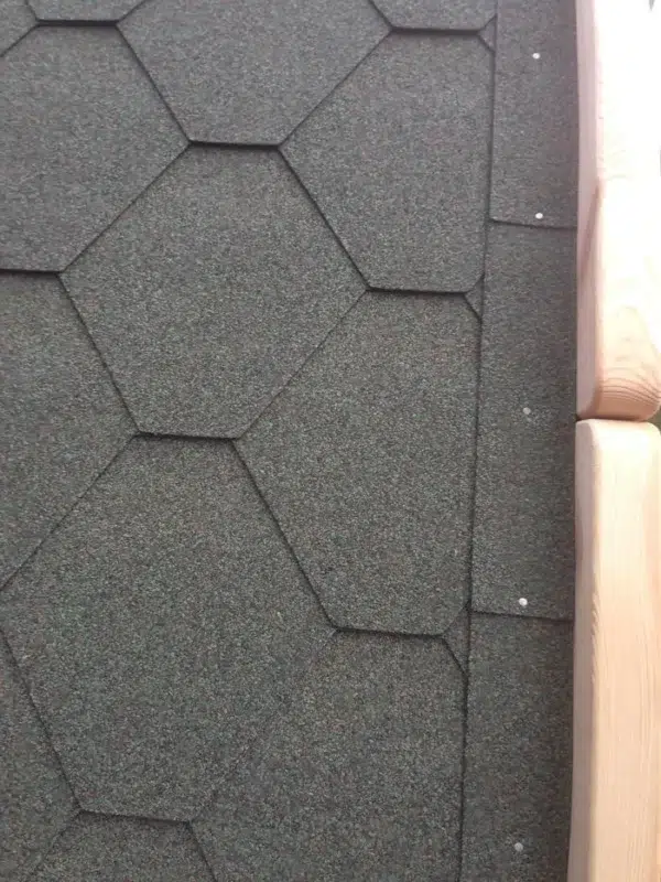 Wooden camping pod, close-up of roof shingles
