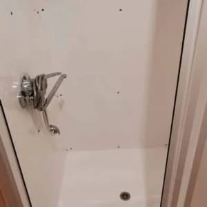 Wooden camping pod, close-up of shower controls